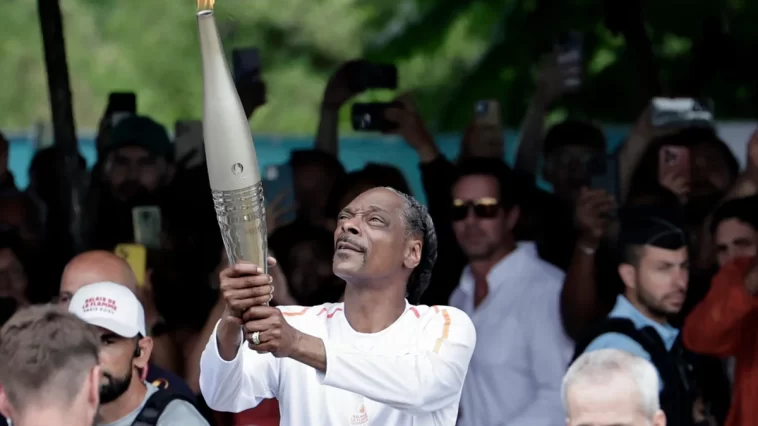 Snoop Dogg's Unique Role at the 2024 Paris Olympics: Torchbearer, Basketball Companion, and Cultural Connector